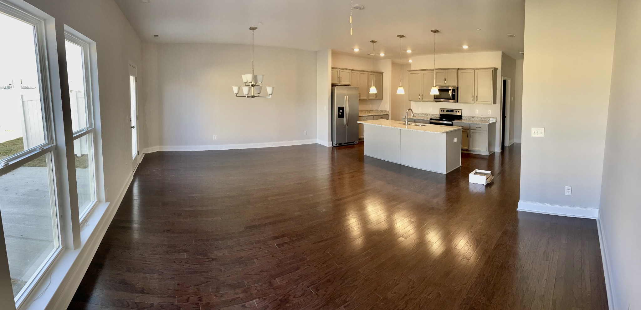 1004 June Wilde Ridge Spring Hill, TN 37174 - Photo 3 of 11 a view of a kitchen with refrigerator and wooden floor