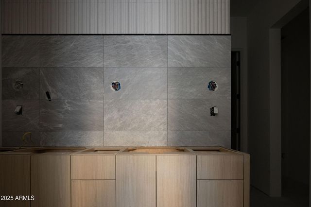 a dining room with furniture and a floor to ceiling window