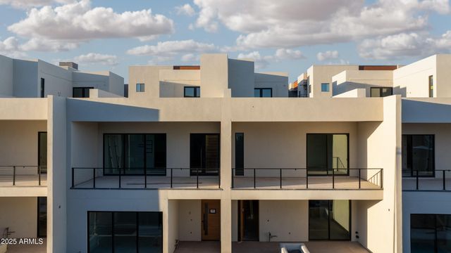 a living room with furniture and large window