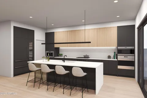 a kitchen with stainless steel appliances granite countertop a refrigerator a stove and a sink