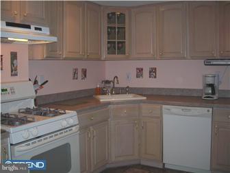 807 Fairview Road Swarthmore, PA 19081 - Photo 4 of 7 a kitchen with stainless steel appliances granite countertop a sink stove and cabinets