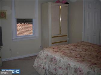807 Fairview Road Swarthmore, PA 19081 - Photo 6 of 7 a bedroom with a bed and a window