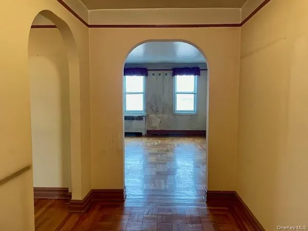 a view of livingroom with hardwood floor and hallway