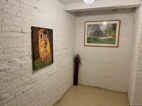 a view of an front door and wooden floor