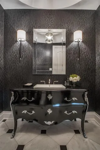 a spacious bathroom with a double vanity sink double mirror and bathtub