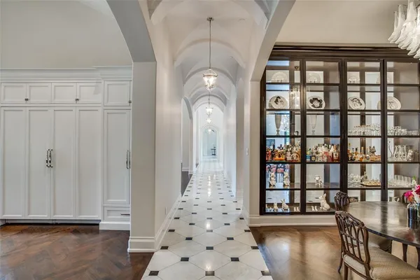 a view of a hallway with entryway wooden floor and front door