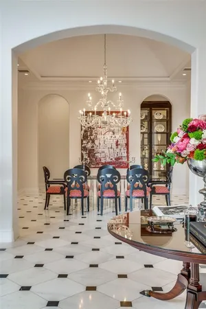 a view of a dining room with furniture and chandelier