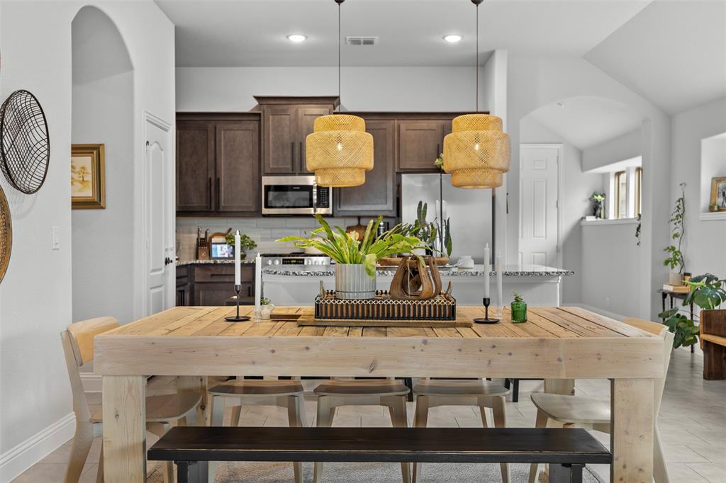 1084 Imperial Eagle Road Alvarado, TX 76009 - Photo 16 of 39 a dining table chairs and a chandelier