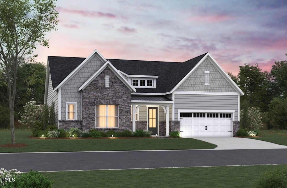 4108 Stonewood Lane Durham, NC 27705 - Photo 2 of 6 a view of a house with a yard