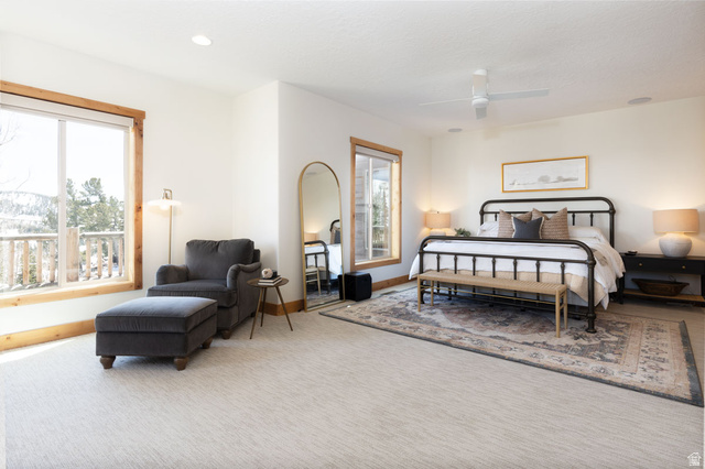 382 Ridgeview Street, Unit 8 & 9 Brian Head, UT 84719 - Photo 16 of 52 Bright bedroom featuring natural light, wood-trimmed windows, recessed lighting, a ceiling fan, and light-toned carpeting
