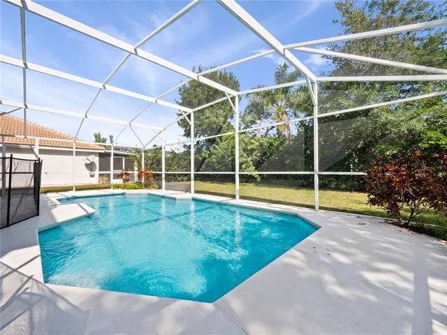a view of a swimming pool with a porch
