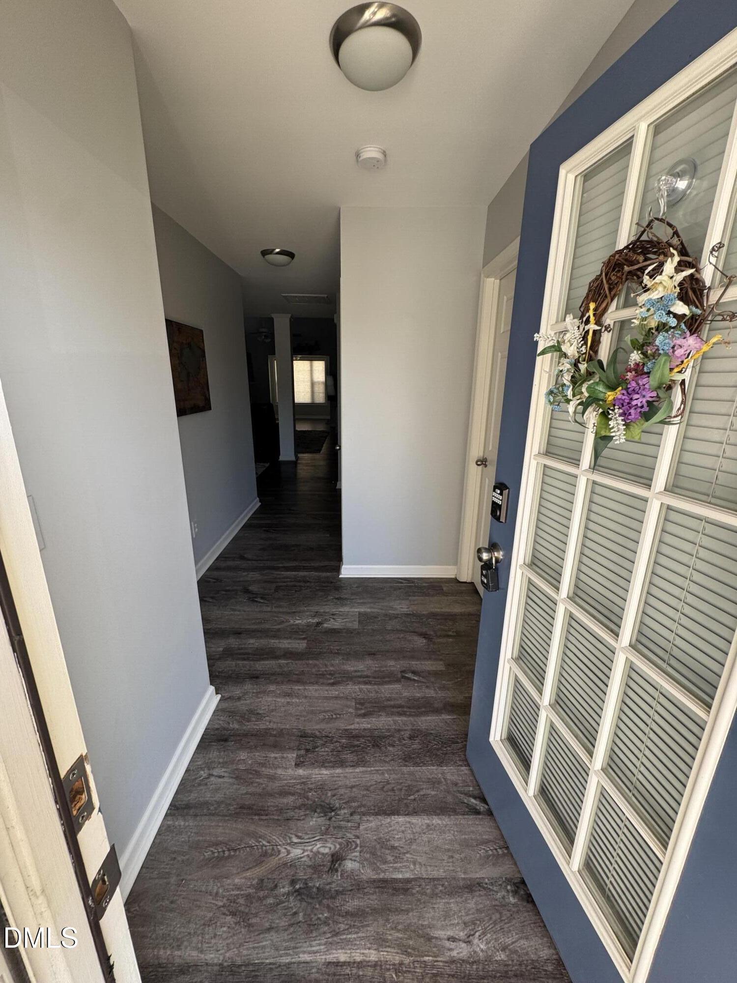 11351 Clubhaven Place, Unit 100 Raleigh, NC 27617 - Photo 4 of 29 a view of entryway with wooden floor