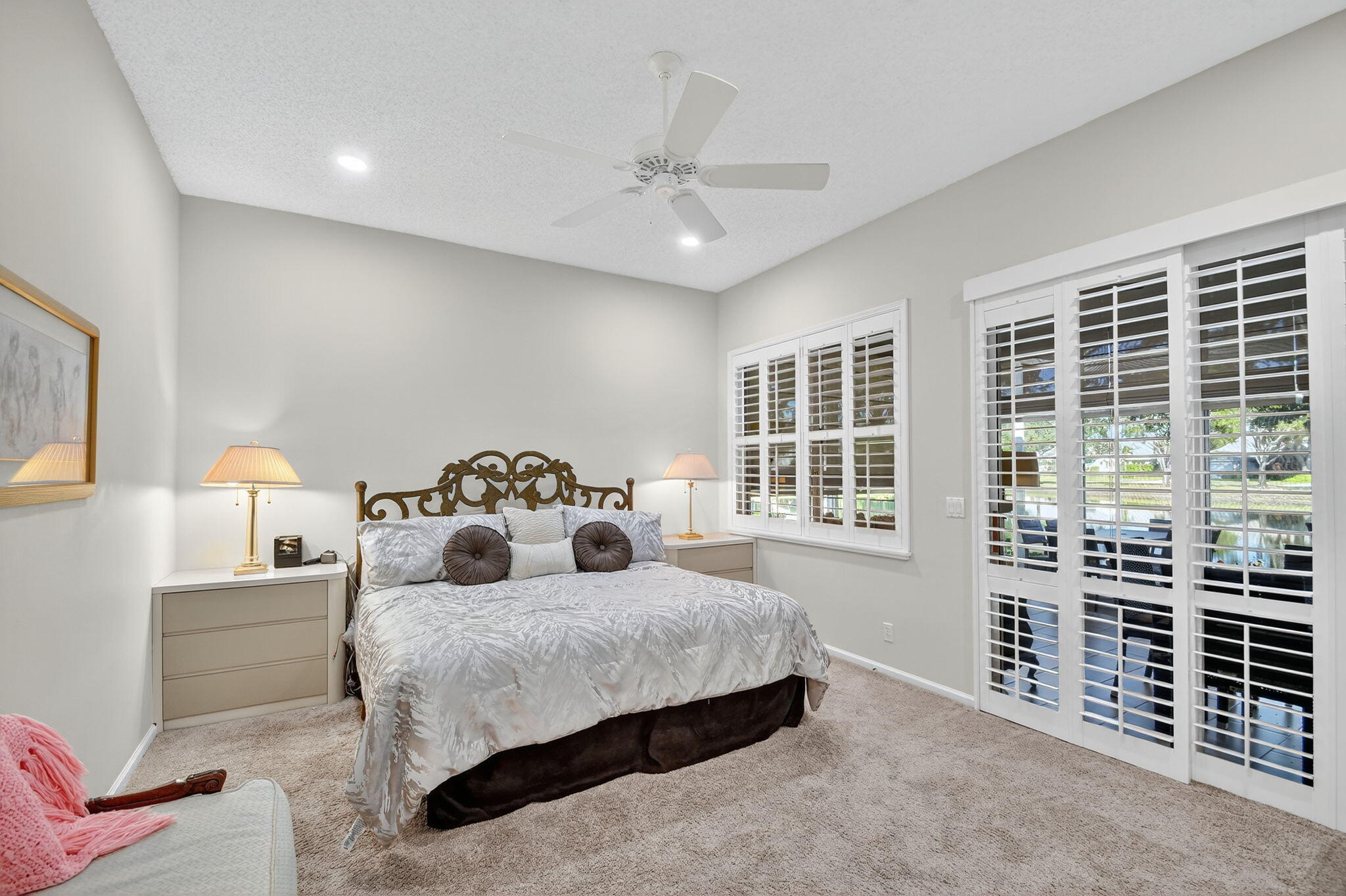7811 Rockford Road Boynton Beach, FL 33472 - Photo 19 of 72 a bedroom with bed and a large window