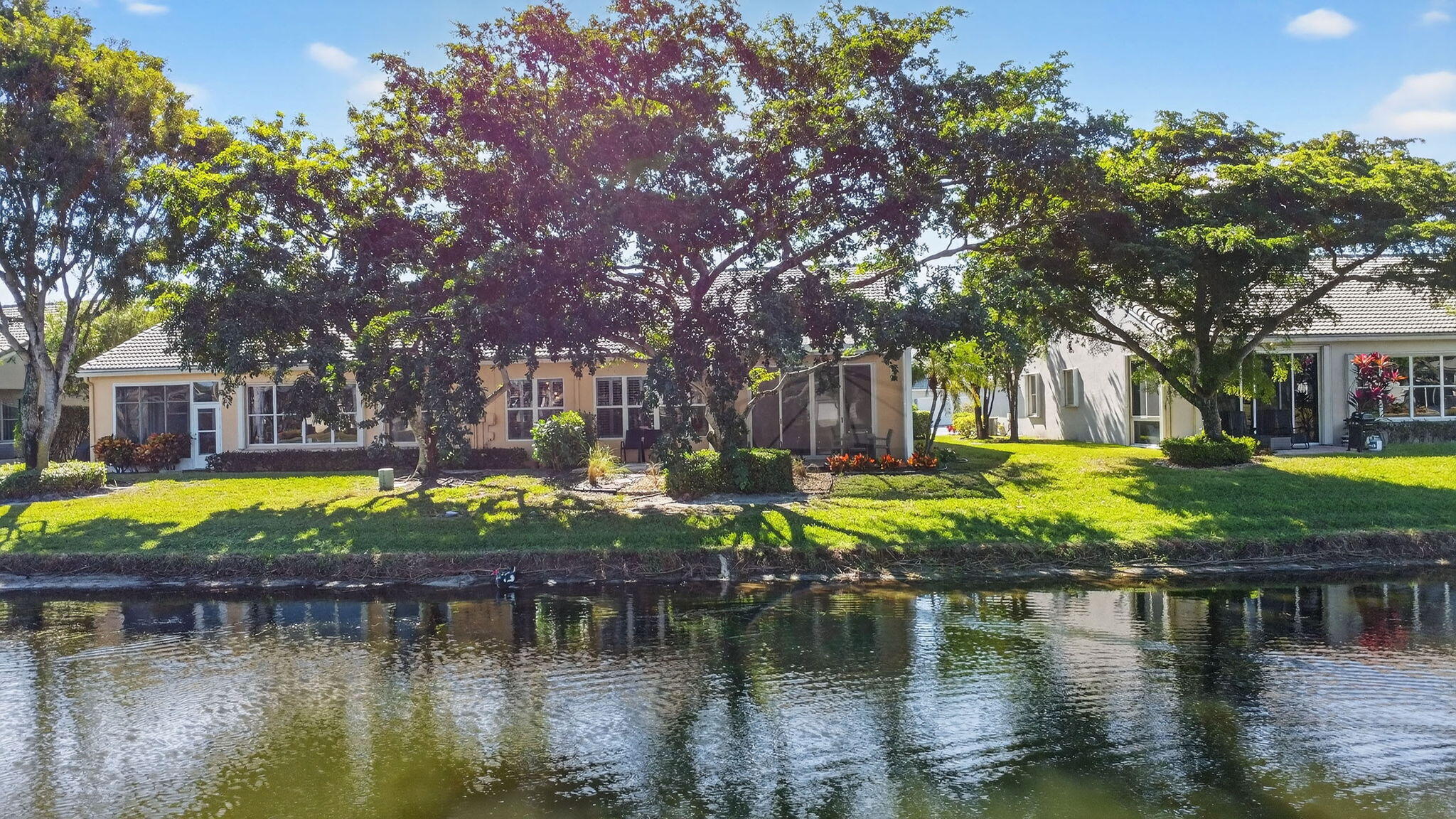 7811 Rockford Road Boynton Beach, FL 33472 - Photo 46 of 72 a view of swimming pool with lawn chairs and plants