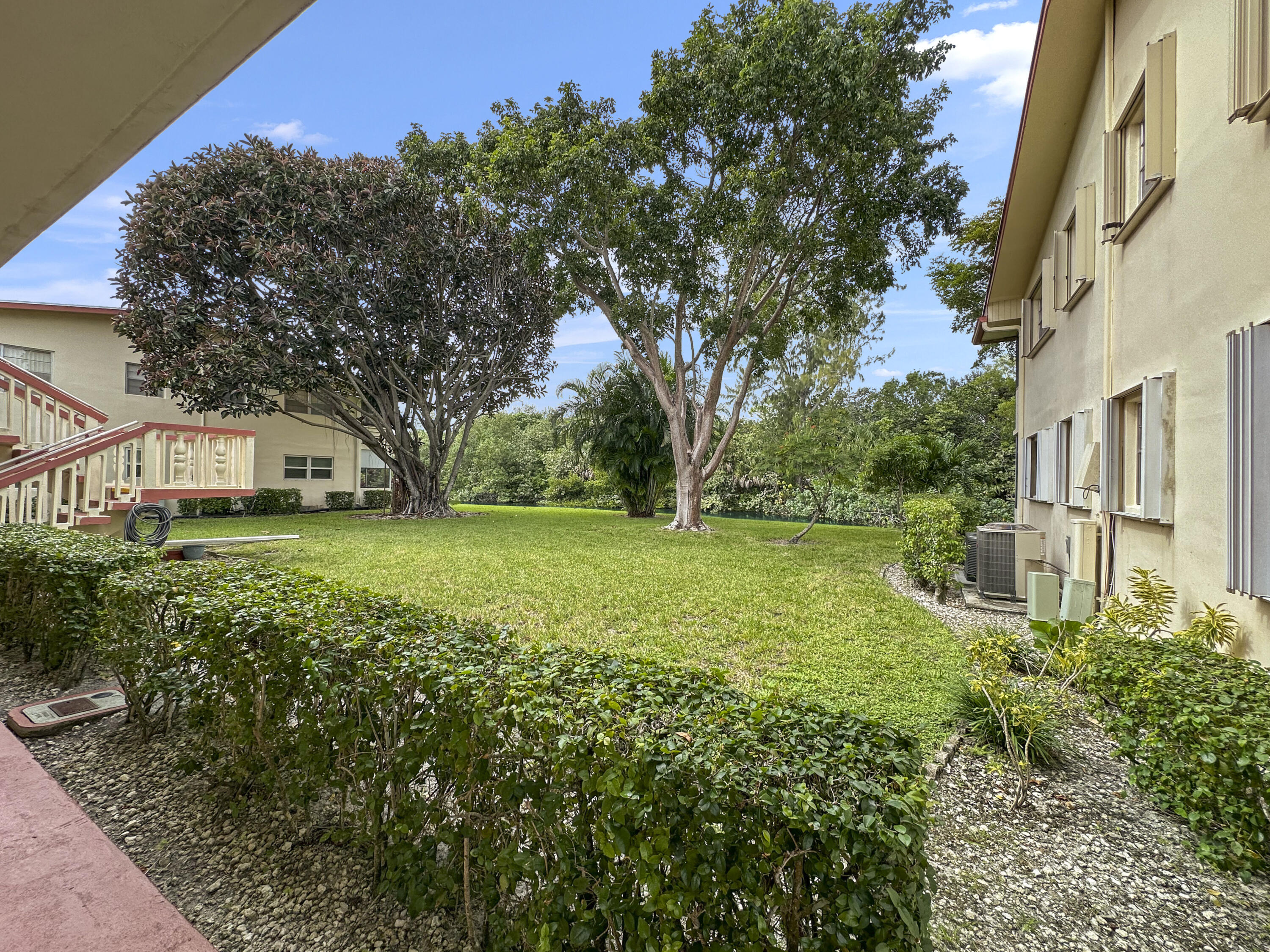 47 Camden B West Palm Beach, FL 33417 - Photo 6 of 36 a view of a house with a yard