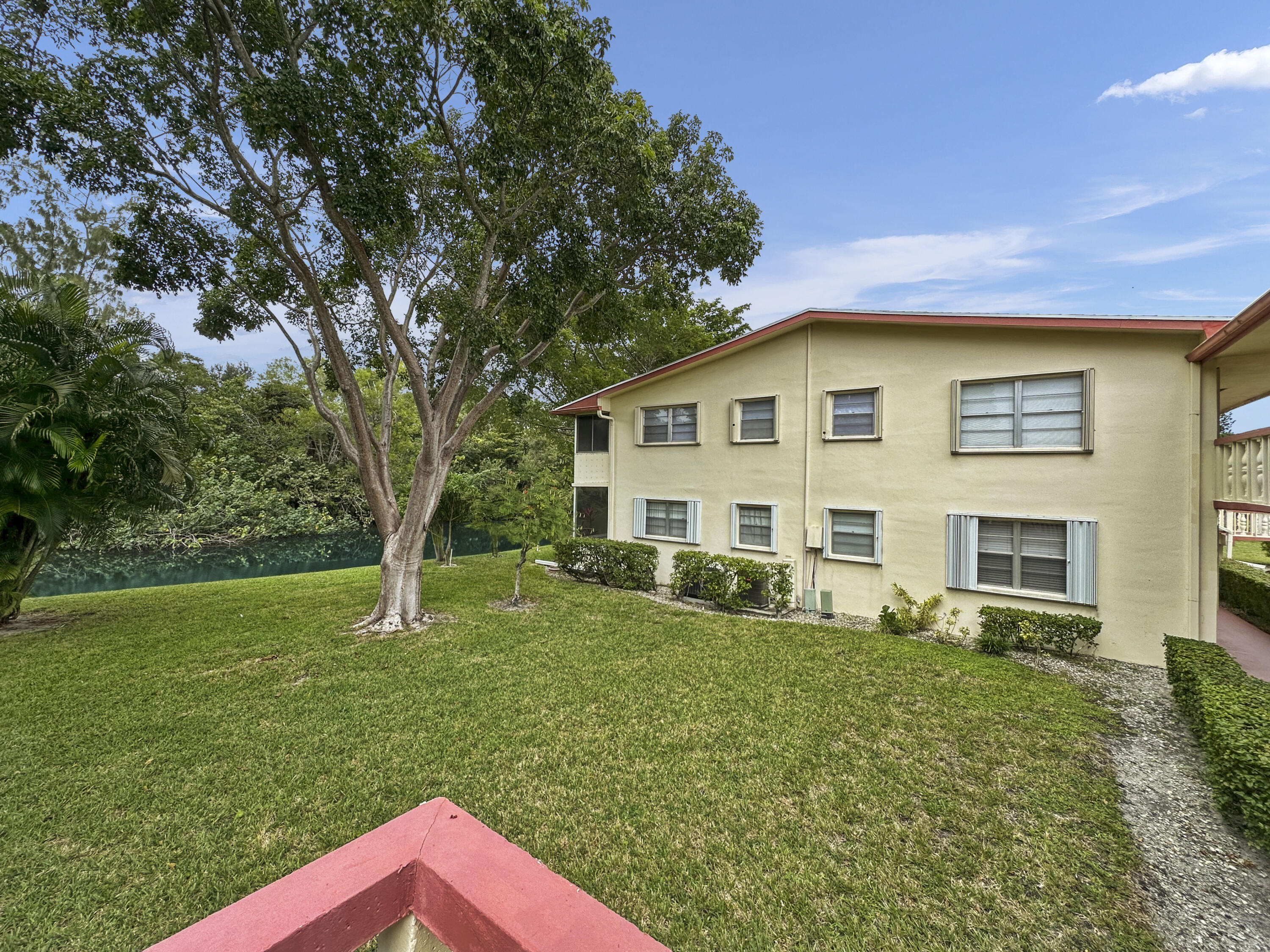 47 Camden B West Palm Beach, FL 33417 - Photo 8 of 36 a view of a house with a yard