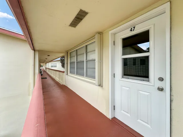 a view of an entryway with a hallway