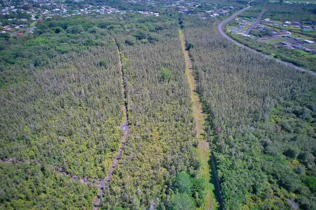 a aerial view of a house with a yard