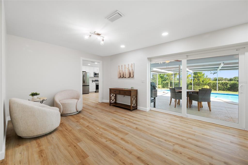 656 Mehlenbacher Road Belleair, FL 33756 - Photo 15 of 49 a living room with furniture and a wooden floor
