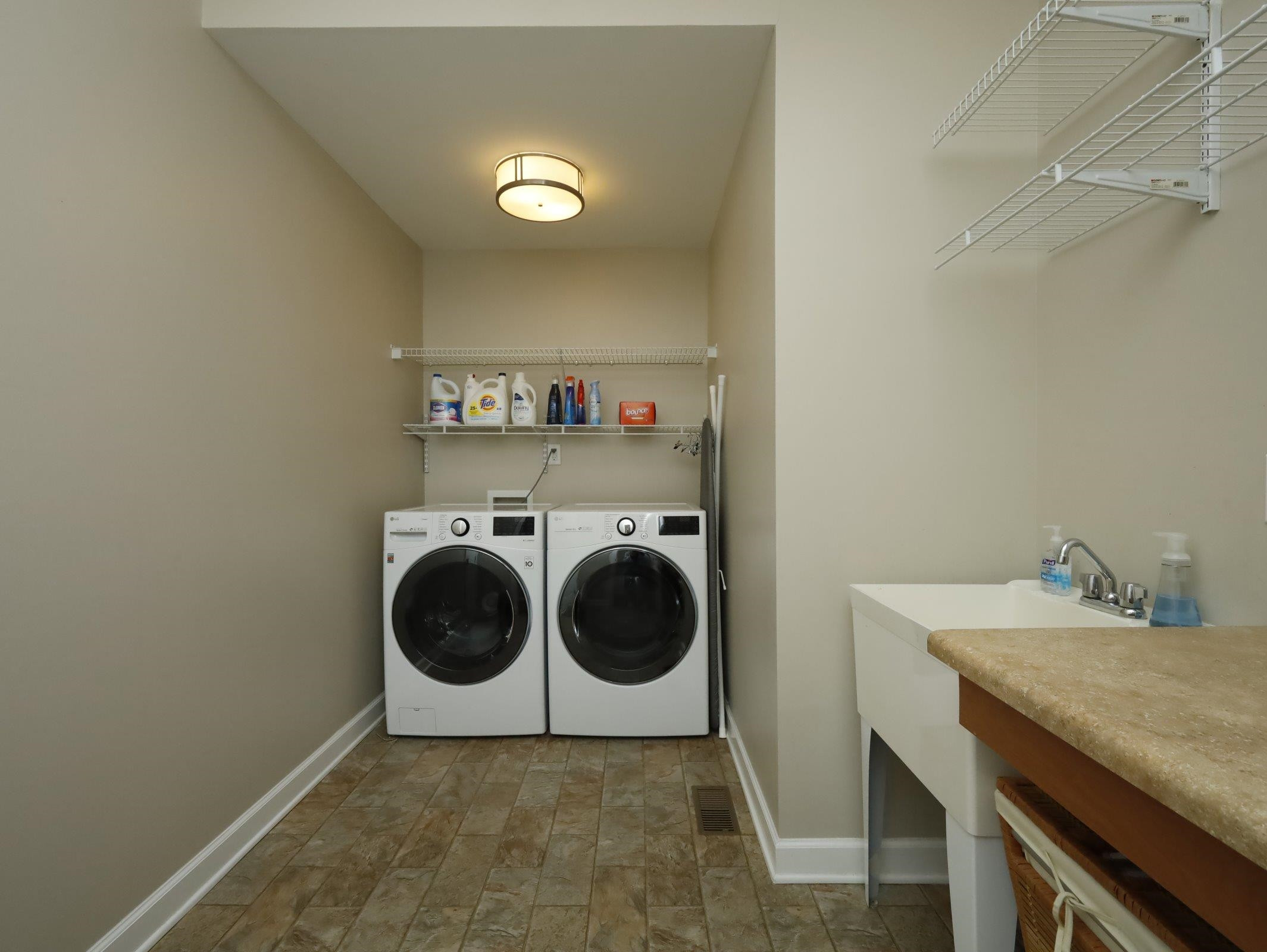 2565 Bittersweet Drive Durham, NC 27705 - Photo 23 of 37 a utility room with sink dryer and washer