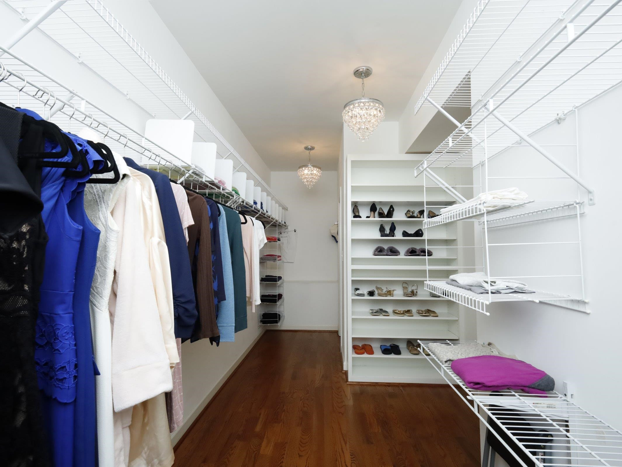 2565 Bittersweet Drive Durham, NC 27705 - Photo 27 of 37 a view of walk in closet with clothes and shoes