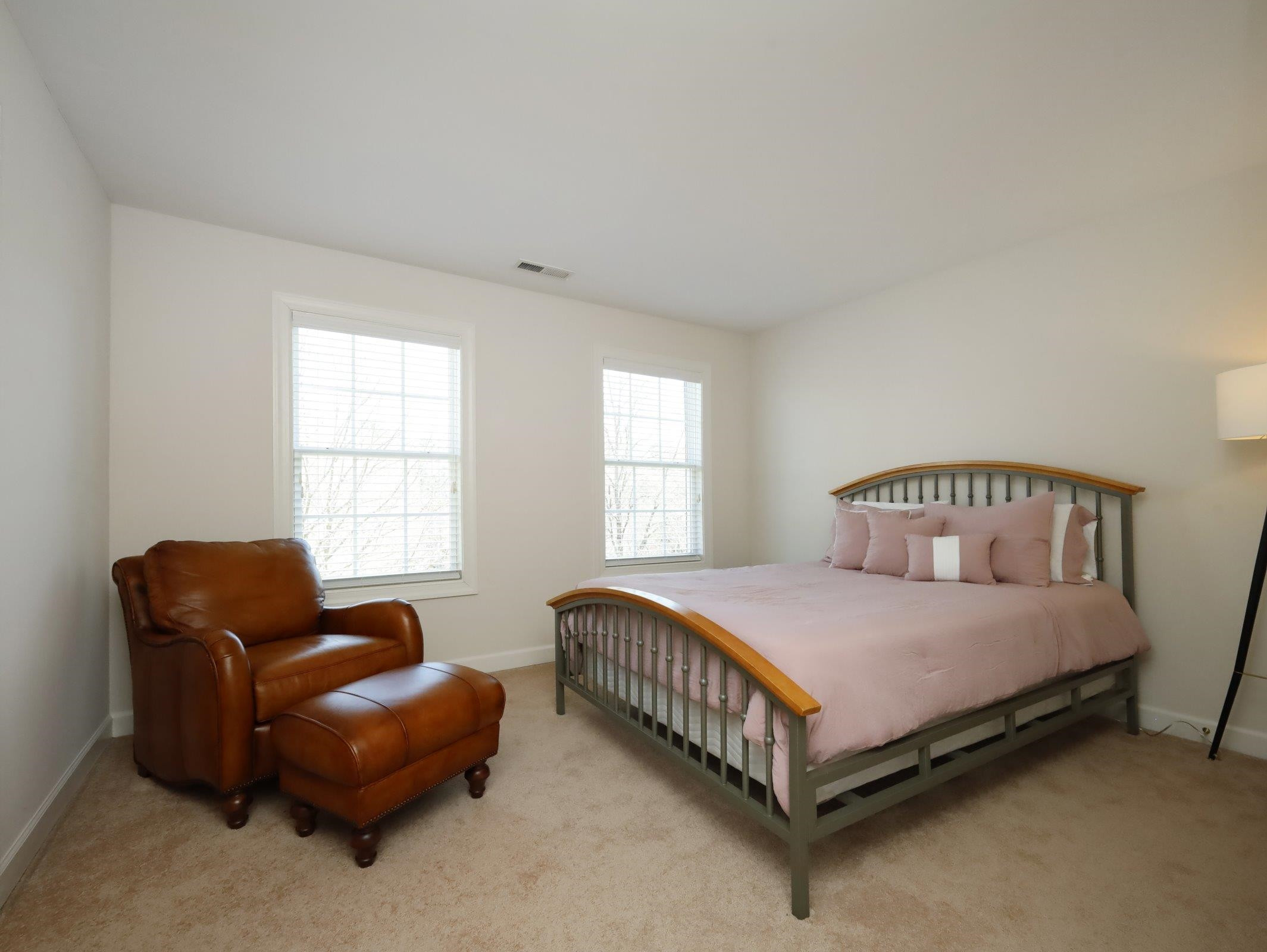 2565 Bittersweet Drive Durham, NC 27705 - Photo 28 of 37 a bedroom with a bed and a couch