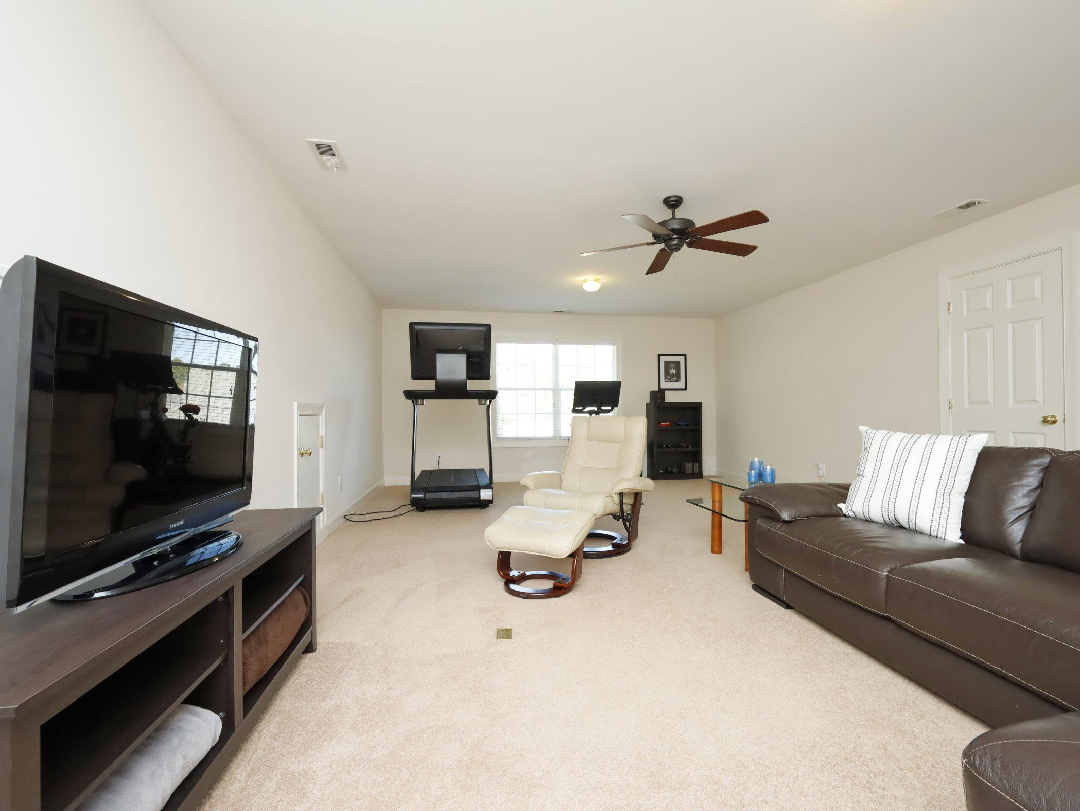 2565 Bittersweet Drive Durham, NC 27705 - Photo 32 of 37 a living room with furniture and a flat screen tv