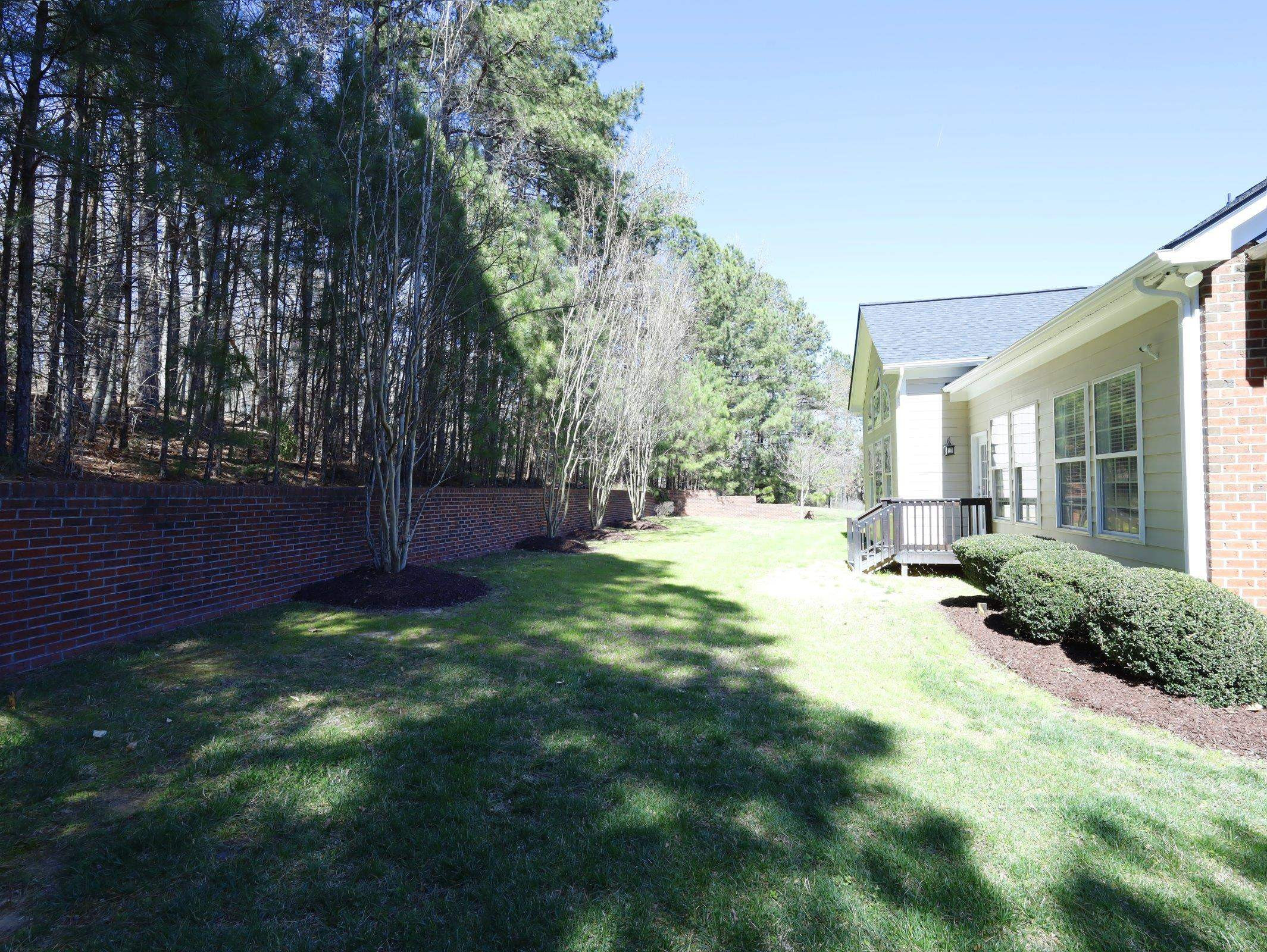 2565 Bittersweet Drive Durham, NC 27705 - Photo 37 of 37 a view of a yard with plants and large trees