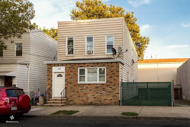 a front view of a house with garage