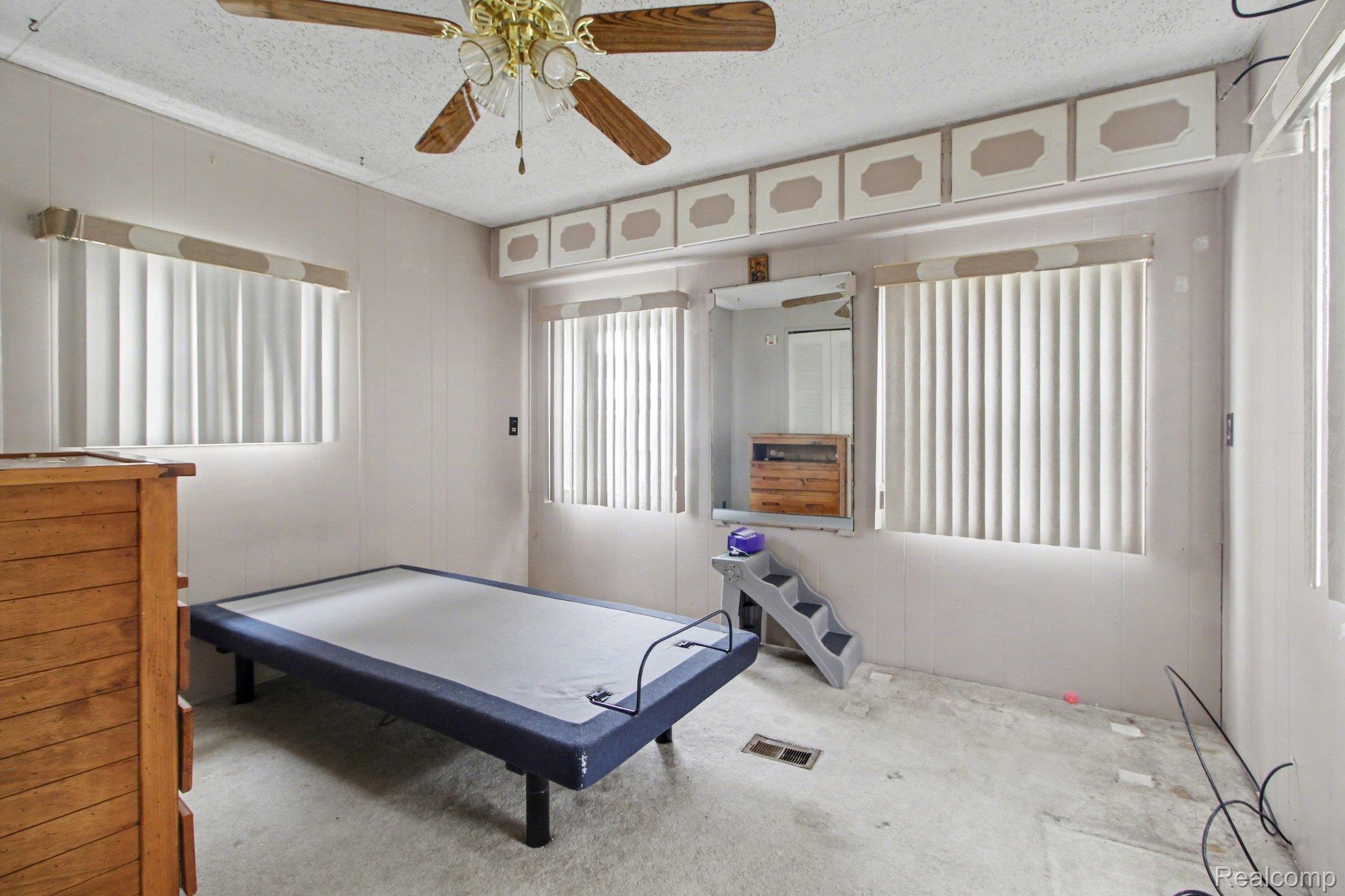 39500 Warren Road, Unit 87 Canton, MI 48187 - Photo 8 of 11 Rec room featuring carpet floors, a textured ceiling, and ceiling fan