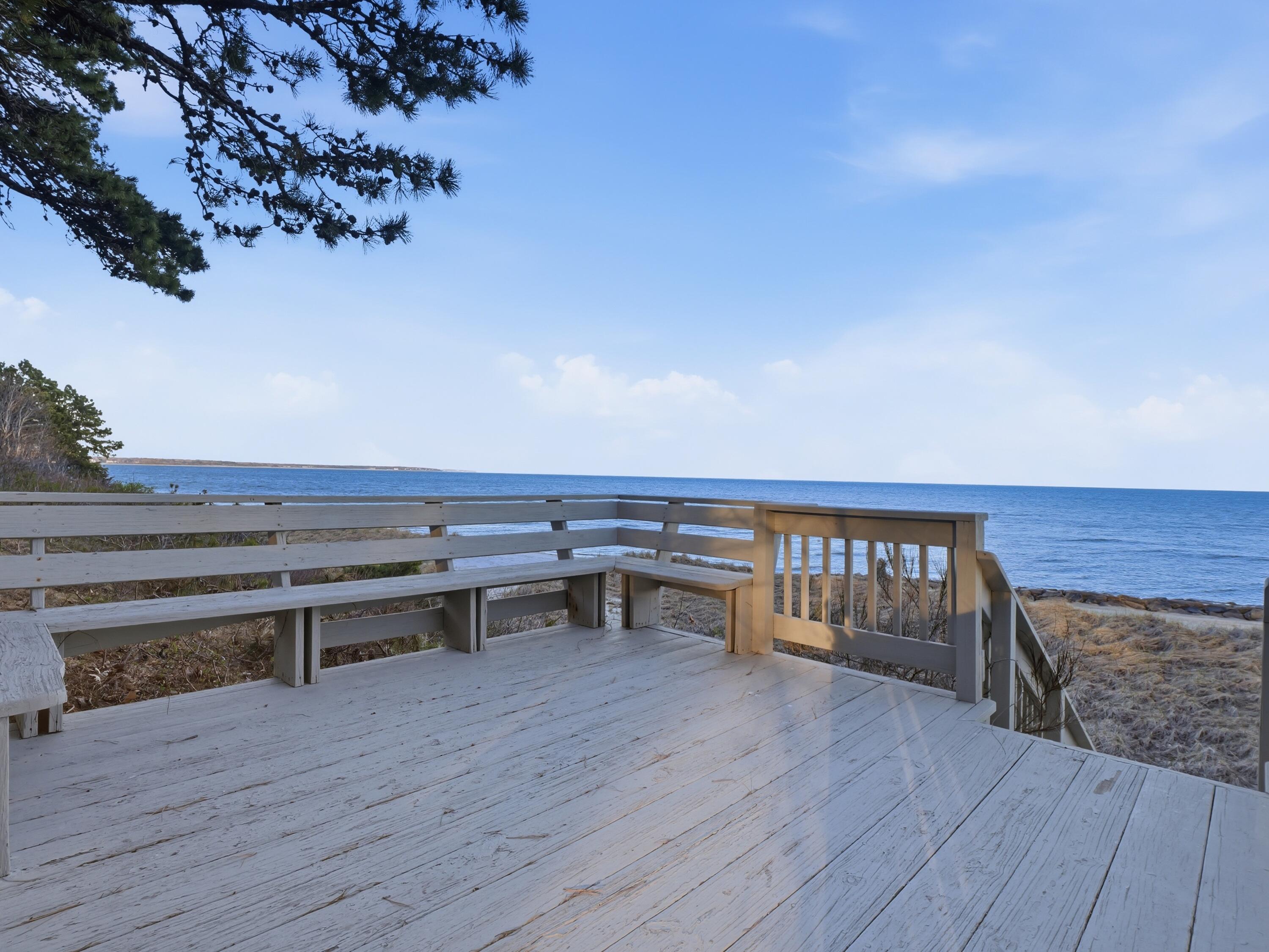 190 Vineyard Road Cotuit, MA 02635 - Photo 10 of 41 a view of a roof deck with wooden floor and seating space