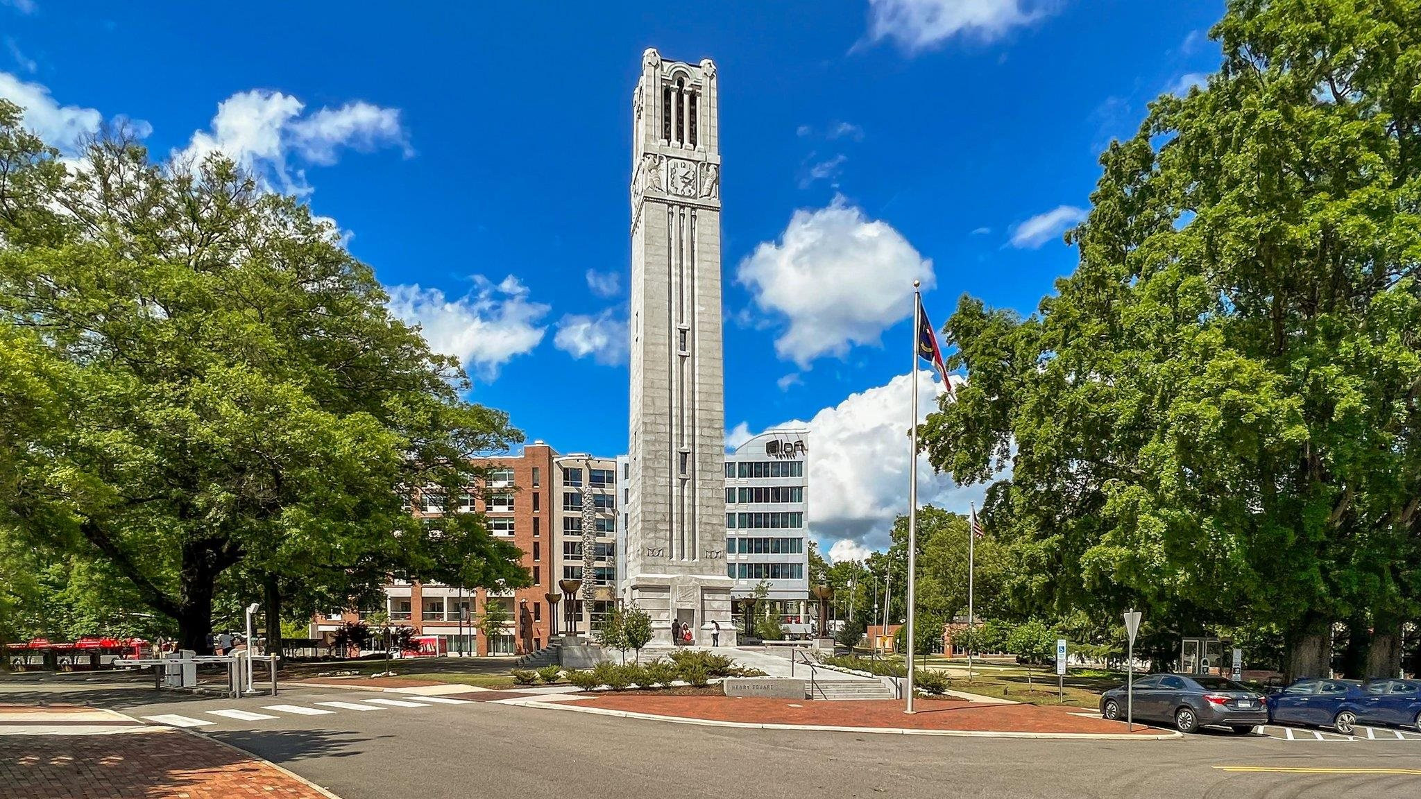 29 Enterprise Street, Unit 300 Raleigh, NC 27607 - Photo 13 of 17 a city street lined with buildings and trees