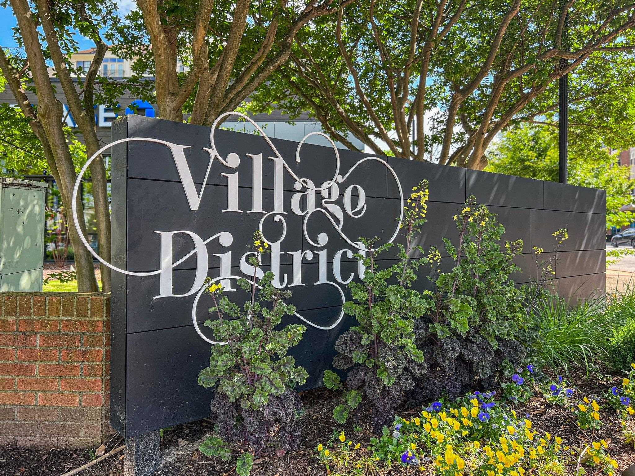 29 Enterprise Street, Unit 300 Raleigh, NC 27607 - Photo 15 of 17 a sign that is on a brick wall