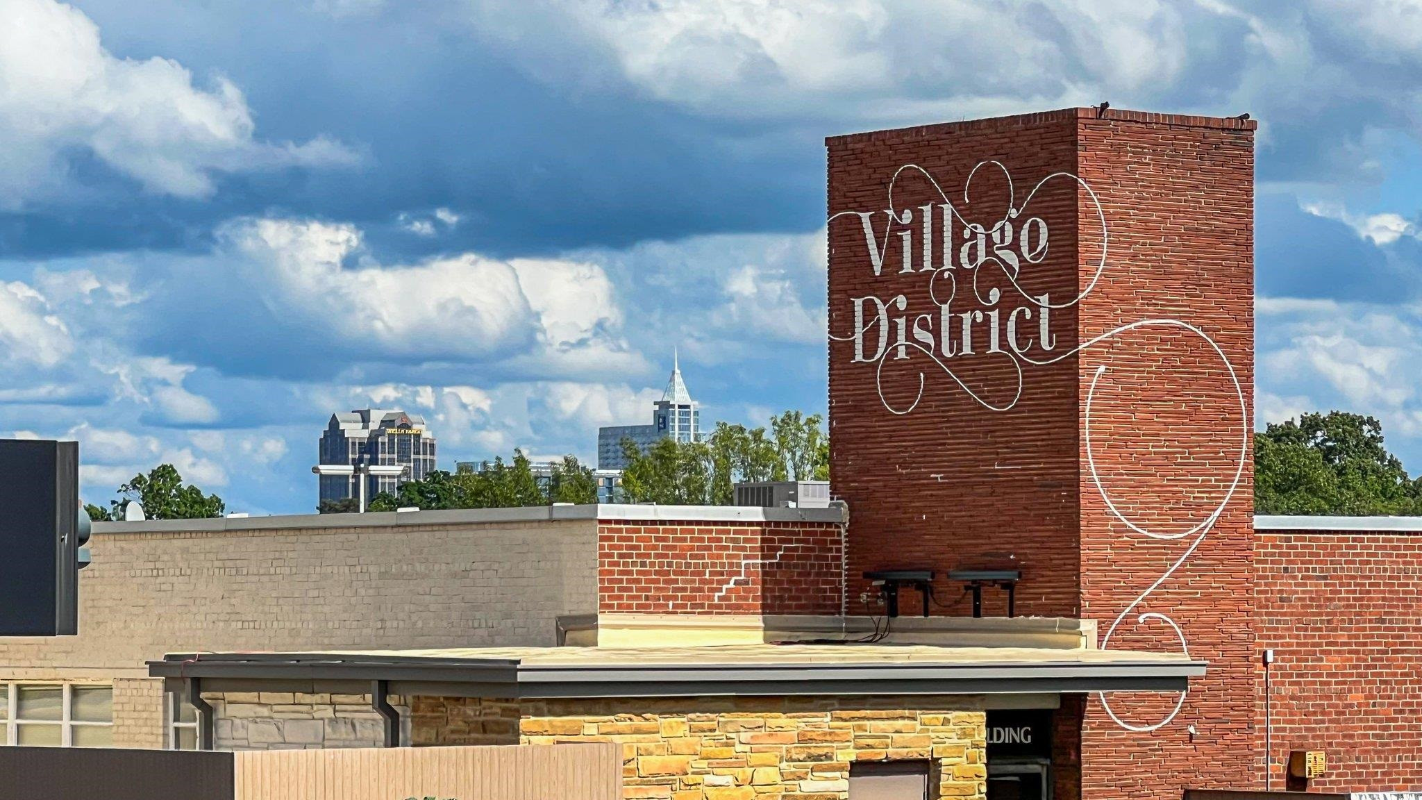 29 Enterprise Street, Unit 300 Raleigh, NC 27607 - Photo 16 of 17 a view of building with sign board