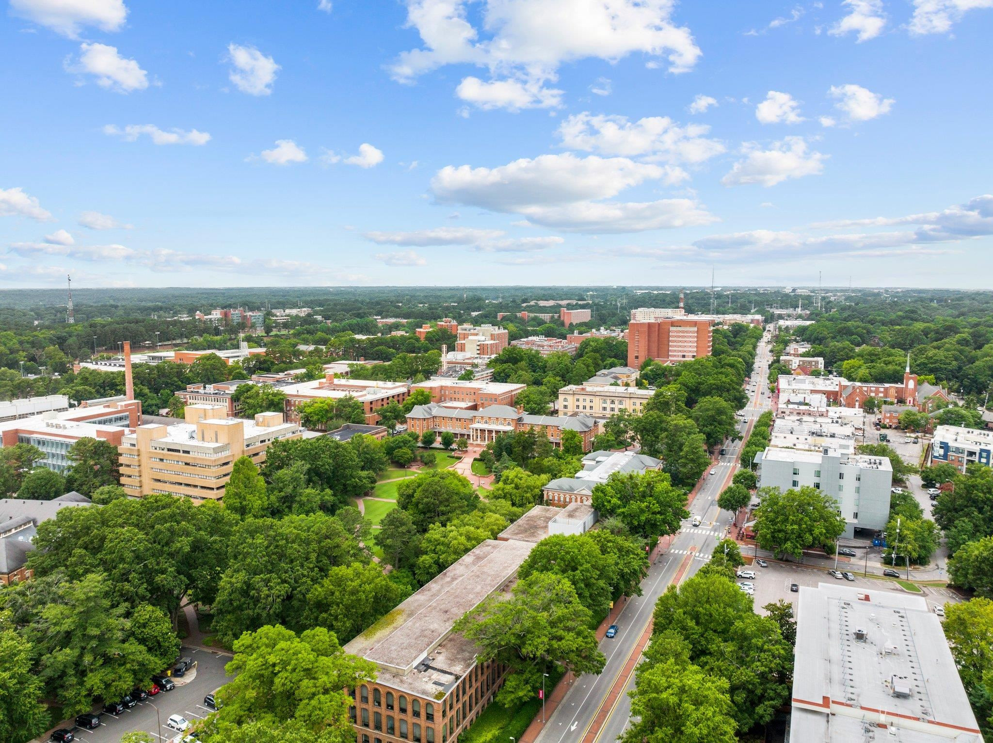 29 Enterprise Street, Unit 300 Raleigh, NC 27607 - Photo 5 of 17 an aerial view of residential houses with outdoor space and street view