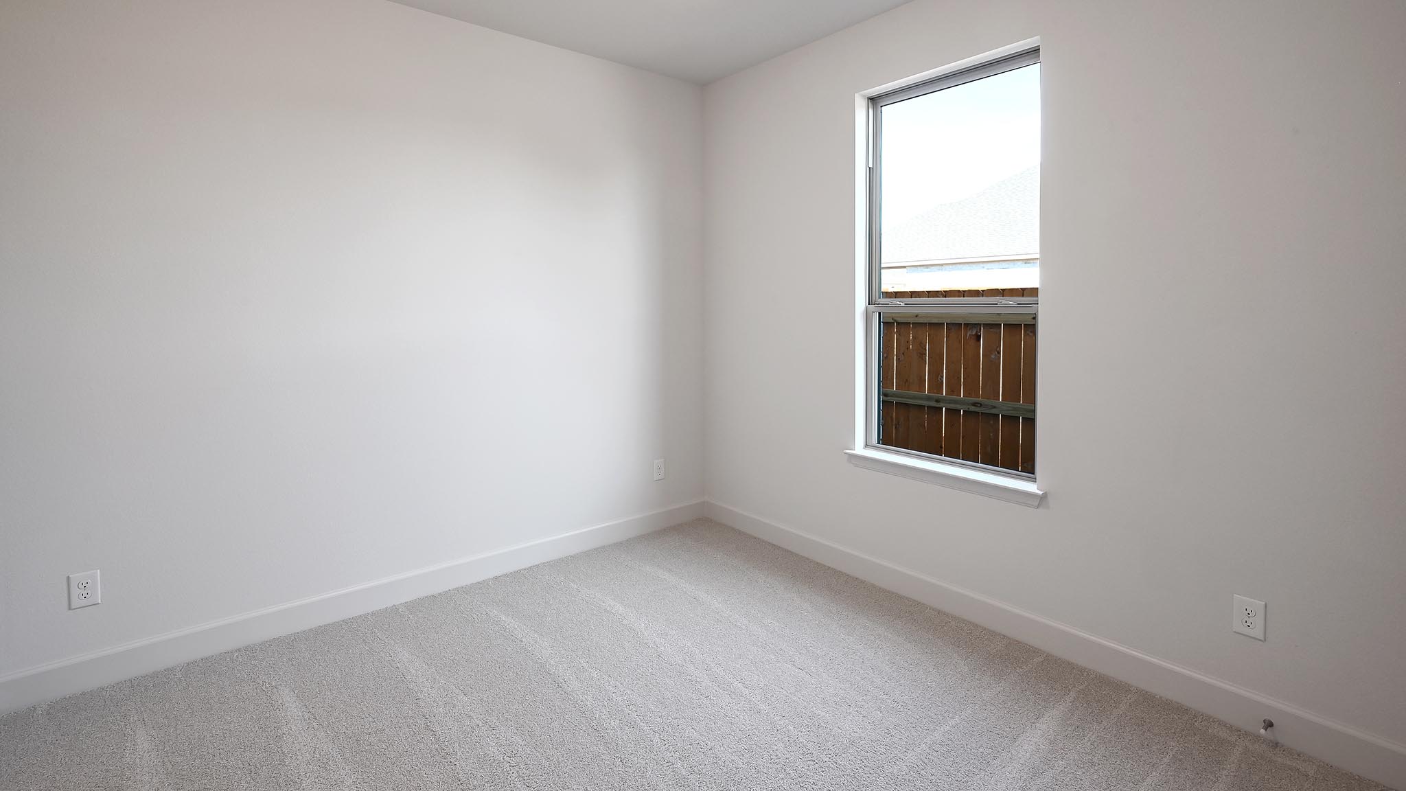 523 Prickly Poppy Loop Kyle, TX 78640 - Photo 17 of 40 Carpeted empty room featuring baseboards