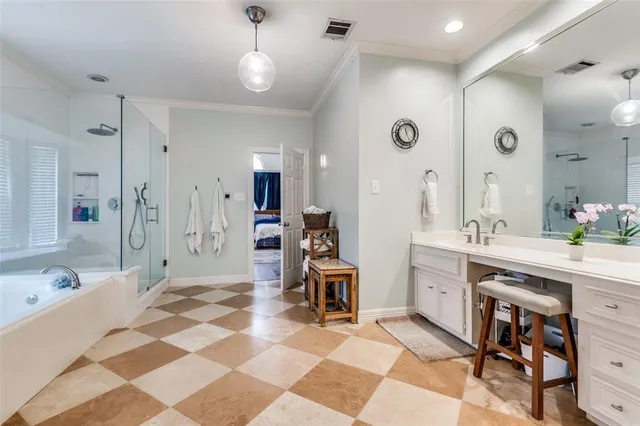 a spacious bathroom with a double vanity sink mirror and a shower