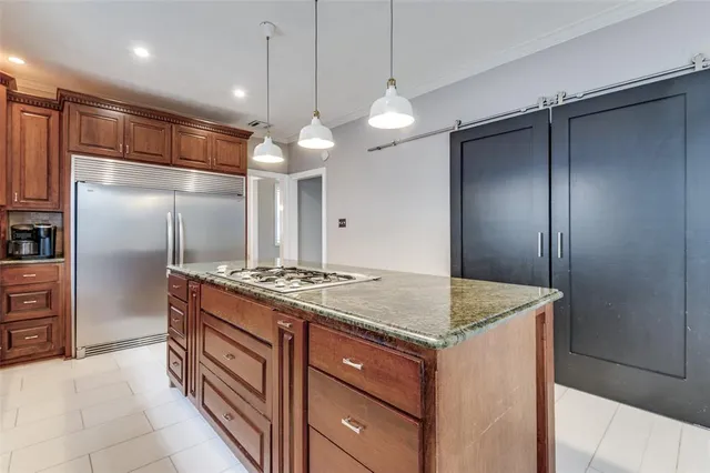 a kitchen with a counter space cabinets and stainless steel appliances