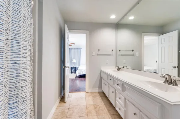 a bathroom with a double vanity sink mirror and double