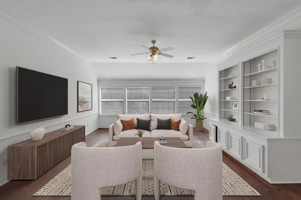 a living room with furniture a flat screen tv and a large window