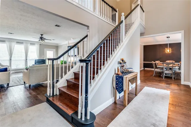a view of entryway and hall with dining room