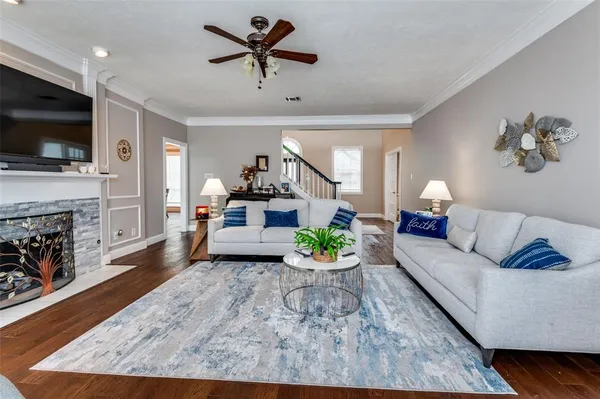 a living room with furniture and a flat screen tv