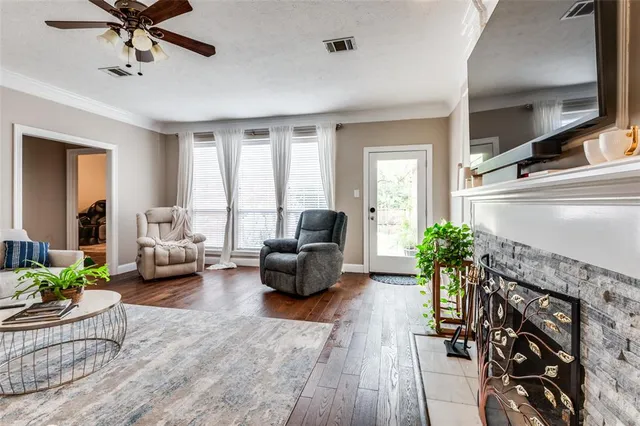 a living room with furniture or couch and a fireplace