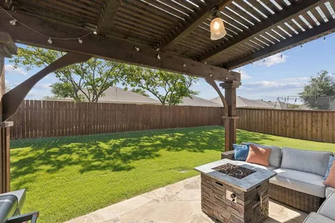 a view of a backyard with furniture