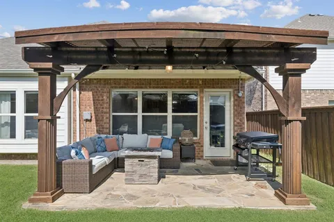 a front view of a house with outdoor seating