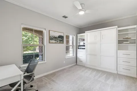 a view of a livingroom with an empty space and a window