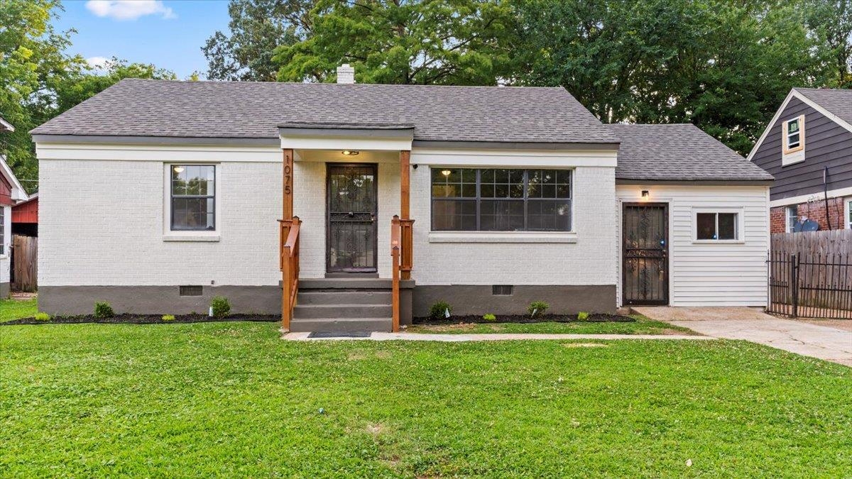 1075 Railton Road Memphis, TN 38111 - Photo 1 of 25 a view of a house with a yard and sitting area