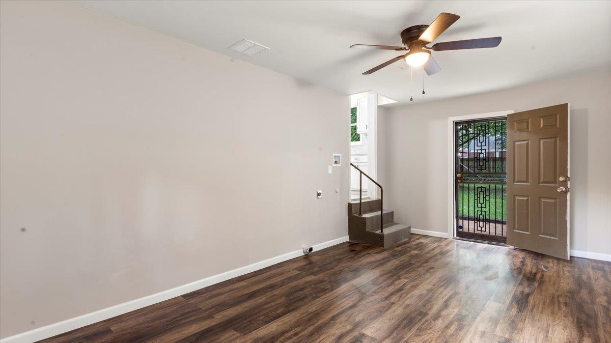 1075 Railton Road Memphis, TN 38111 - Photo 11 of 25 wooden floor in an empty room with a window