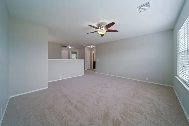 a view of a big room with carpet
