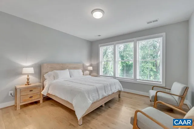 a bedroom with bed and window